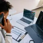 Sales person with mobile phone and notebook
